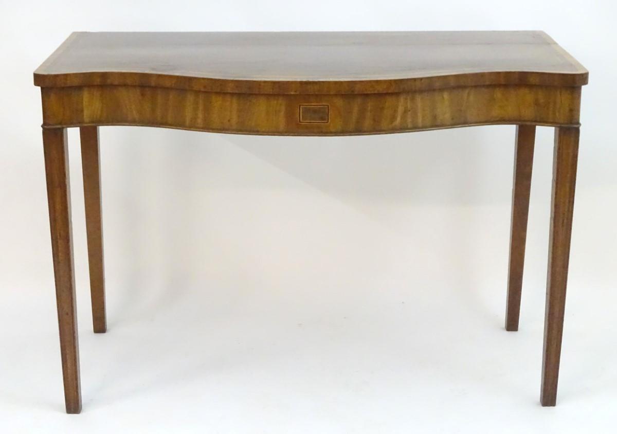 An early 19thC mahogany serving table with a serpentine shaped front, crossbanded top and having - Image 13 of 17