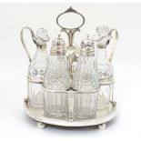 A Geo III silver cruet stand hallmarked London 1806 with 5 cut glass cruet bottle. The whole approx.