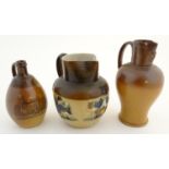 Two Doulton Lambeth jugs, a stoneware jug decorated with a view of Dunkeld Cathedral, and a