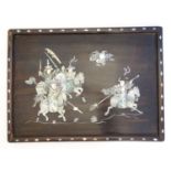 An Oriental hardwood tray with abalone inlay depicting warriors fighting on horseback, stylised
