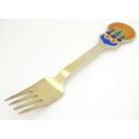 A Danish Sterling silver gilt and enamel 1979 Christmas fork with 'the sun kingdom' design. Maker