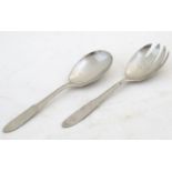 A pair of Scandinavian stainless steel salad servers designed by Georg Jensen, Made in Denmark.