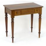 A late 19thC mahogany table with a rectangular top with two short drawers above turned tapering