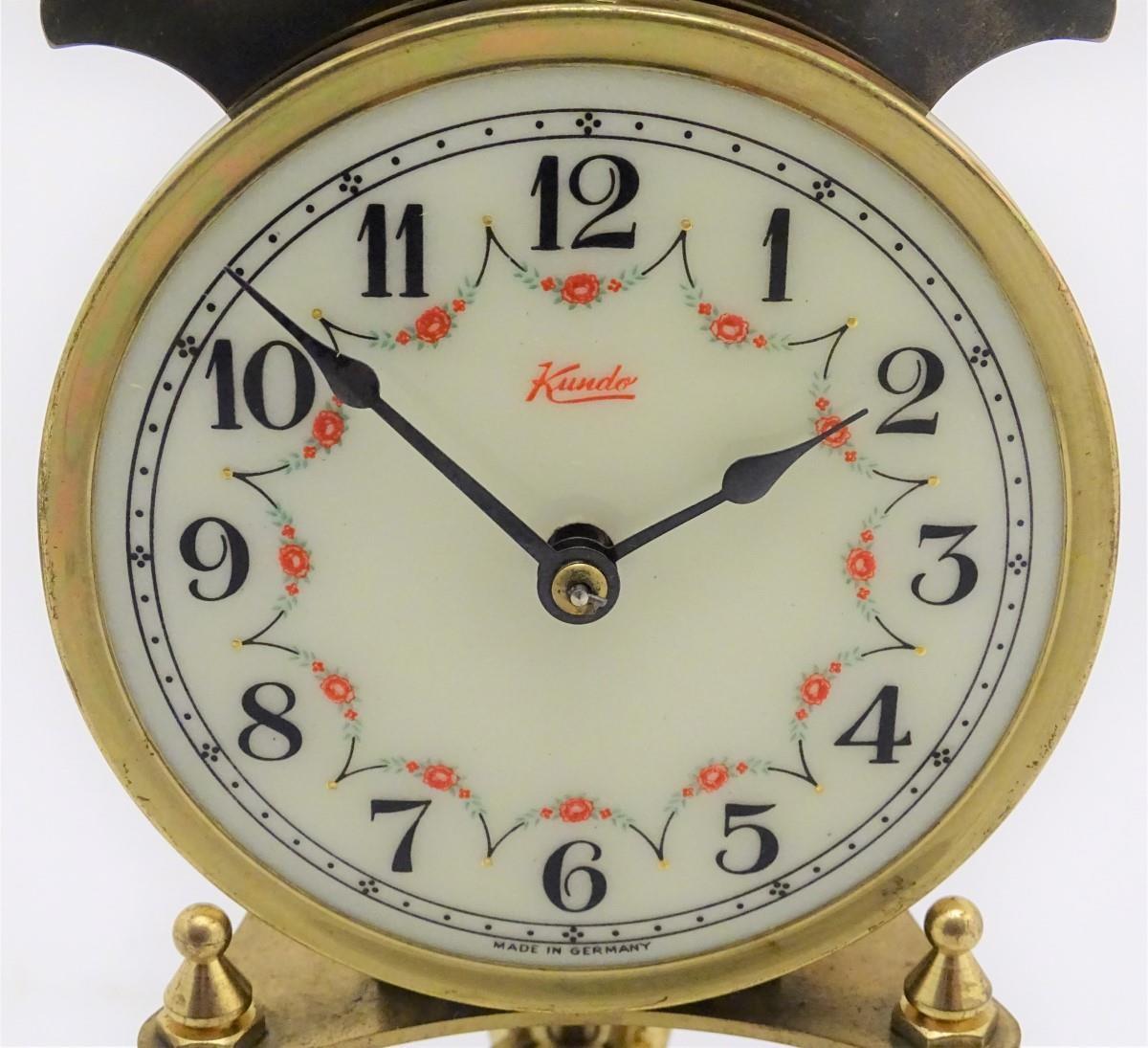 A mid 20thC 'Kundo' anniversary clock with a glass dome above a brass frame. 12" high. Please Note - - Image 13 of 13