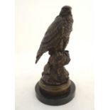 An early-20thC cast model of an eagle, mounted upon a black marble base. 11 1/2" tall Please