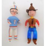 Two glass baubles formed as figures, one modelled as a Houston Oilers player, the other a Texas