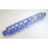 A 19thC Nailsea glass rolling pin, with knop handles, decorated with blue and white detail. 16 1/