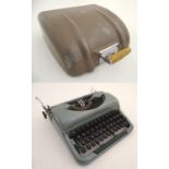 A mid-20thC cased Imperial 'Good Company 4' typewriter, in metallic green finish. 11" wide, 12"