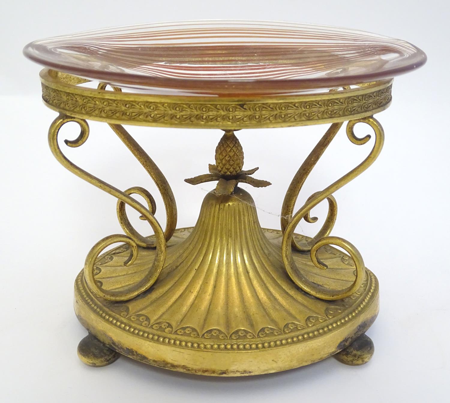 A c.1903 Elkington & Co. gilt metal oval centrepiece stand with scrolling decoration and central