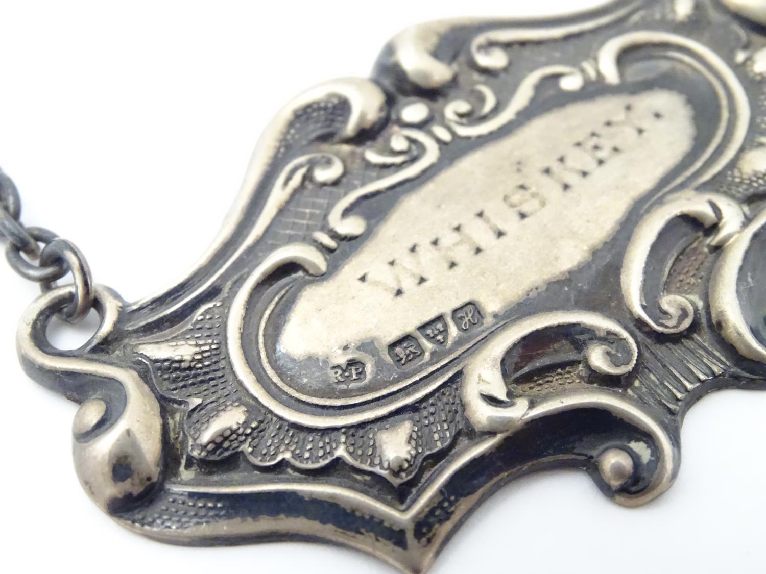 A silver decanter label / bottle ticket of escutcheon shape, marked Whiskey, hallmarked Chester - Image 10 of 11