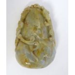 A Chinese carved stone depicting stylised animals. Approx. 3" x 2" x 1/2" Please Note - we do not