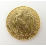 A French Republic 20 franc gold coin, 1909, approx. 6.45g Please Note - we do not make reference