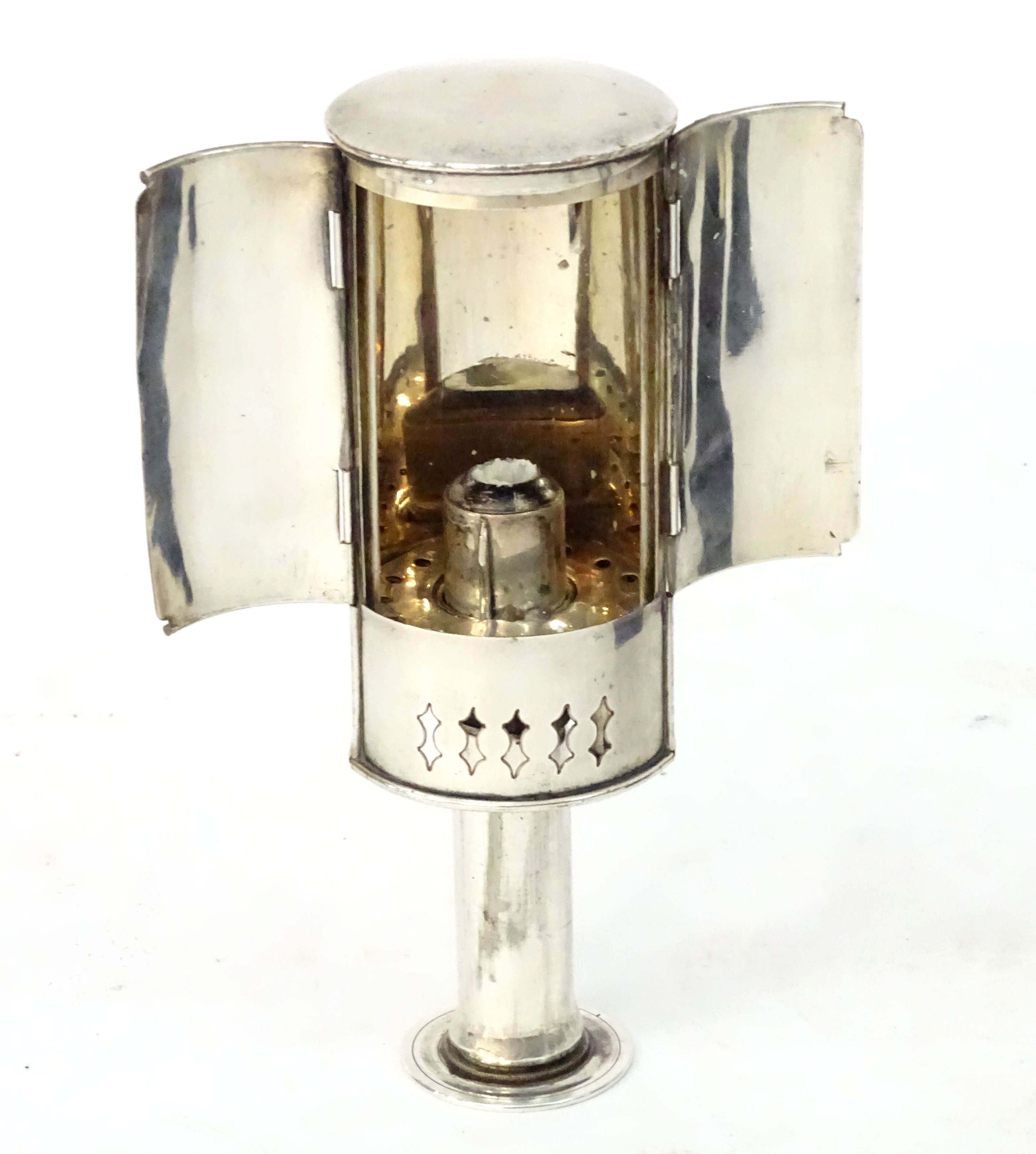 A 19thC silver plate travelling candle lantern with pierced decoration and double doors. Contained