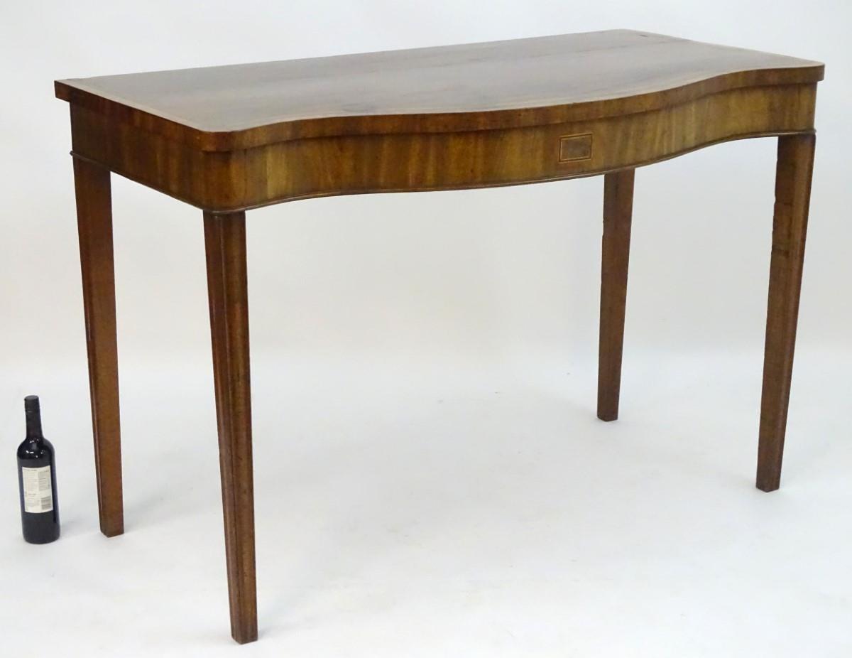 An early 19thC mahogany serving table with a serpentine shaped front, crossbanded top and having - Image 6 of 17