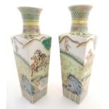 A pair of Chinese square sectional vases with flared rims, decorated with horses in a landscape