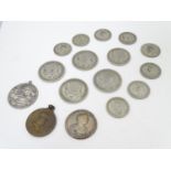 An assortment of British silver coinage, comprising Half Crowns from 1920 (2), 1921 and 1935, a 1921