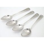 A set of 4 teaspoons with bright cut decoration. Hallmarked London 1911 maker C S Harris & Sons Ltd.