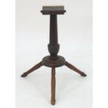 An unusual Georgian mahogany tripod table base. 27 1/2" high. Please Note - we do not make reference