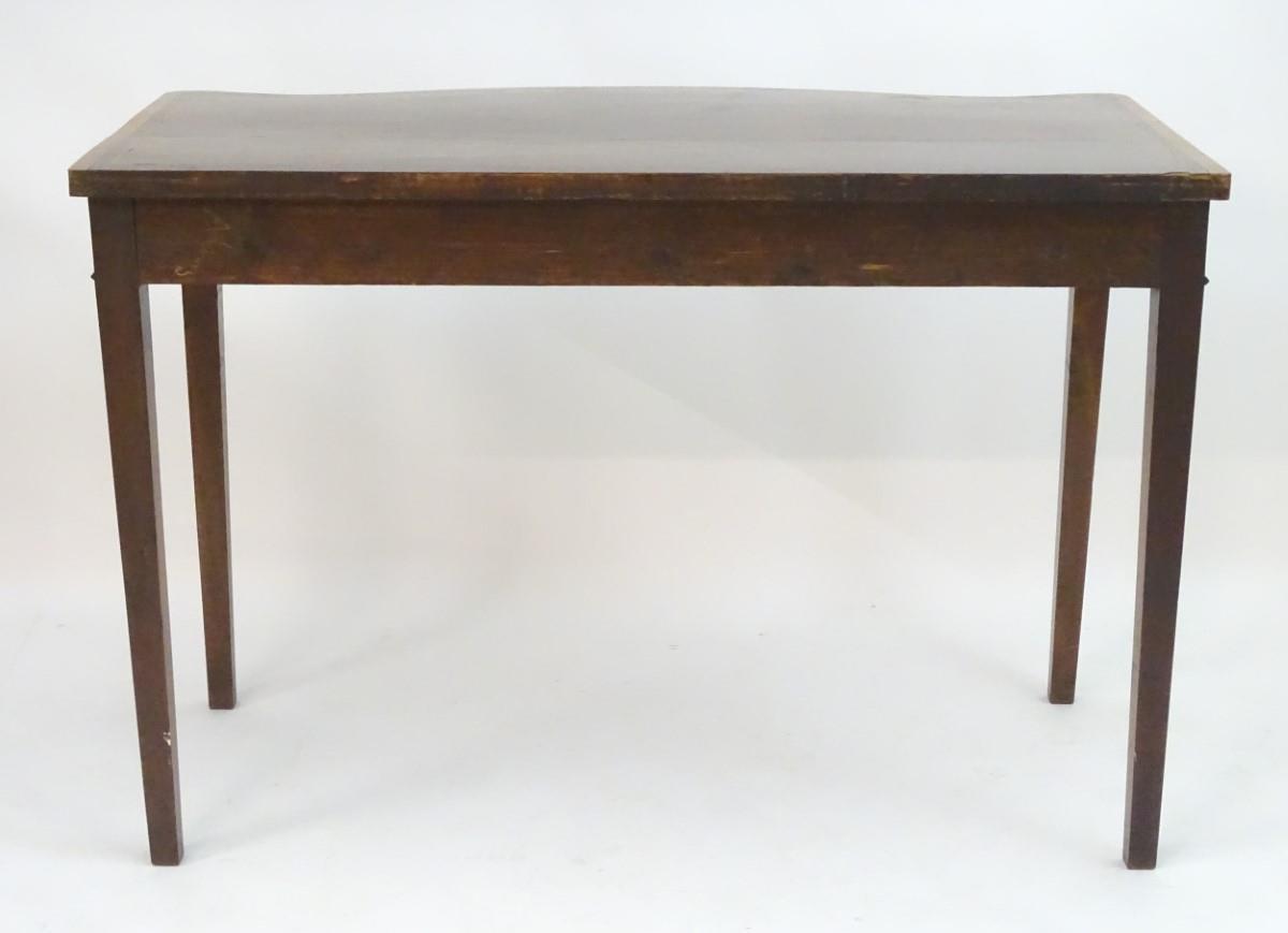 An early 19thC mahogany serving table with a serpentine shaped front, crossbanded top and having - Image 17 of 17