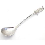 A Scandinavian .830 silver souvenir spoon with reindeer and sleigh decoration to handle, figure with