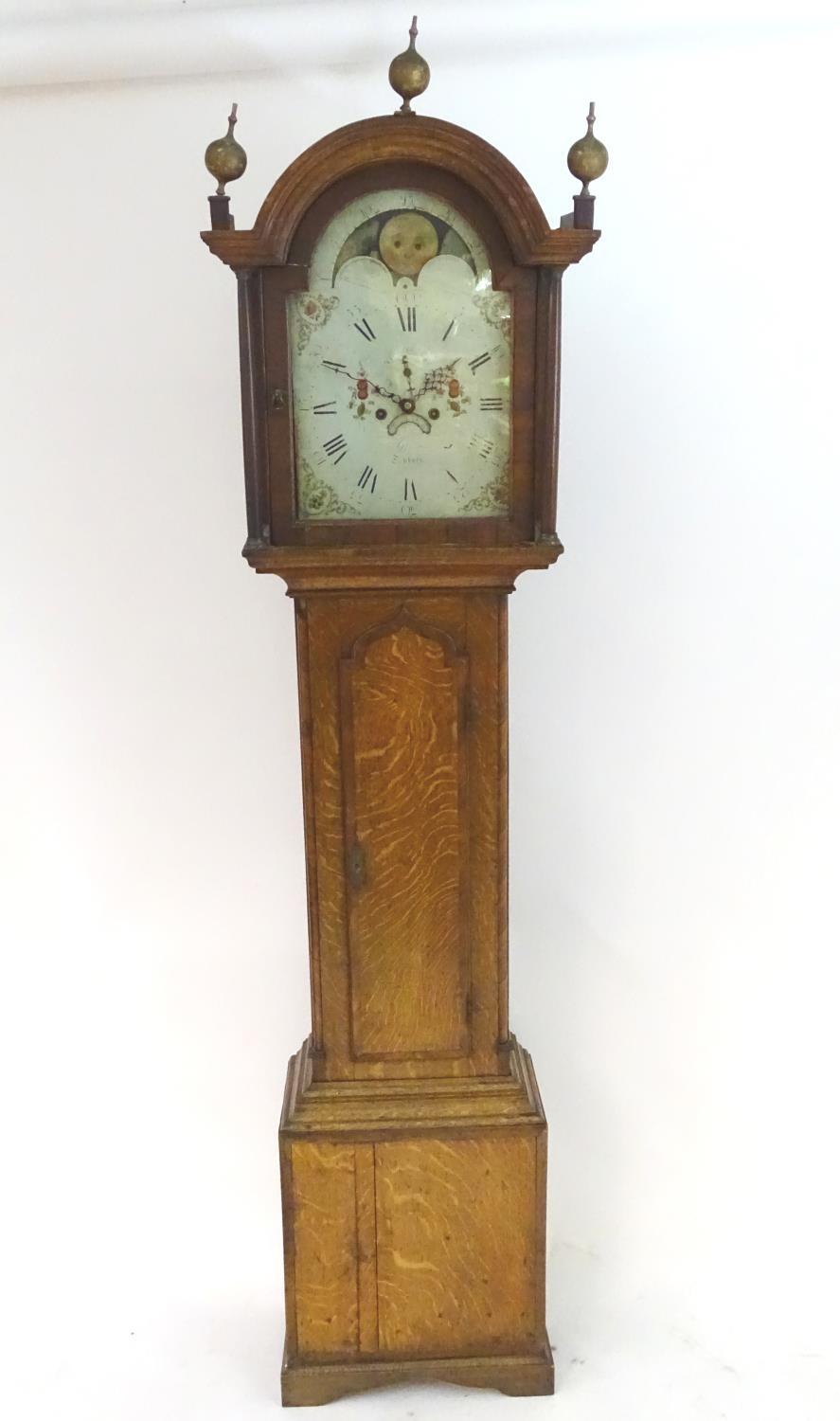 A late 18thC 8 day longcase clock with painted arched enamel dial having rolling moon, the dial