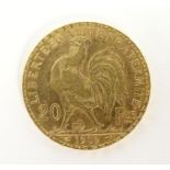 A French Republic 20 franc gold coin, 1909, approx. 6.45g Please Note - we do not make reference