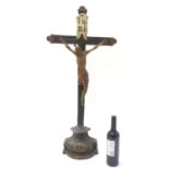 A large 19thC polychrome crucifix with an I. N. R. I. flag and a carved wooden Corpus Christi,