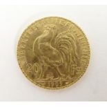 A French Republic 20 franc gold coin, 1909, approx. 6.45g Please Note - we do not make reference