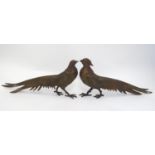 A pair of cast menu holders formed as Lady Amherst pheasants. Largest approx. 11" long Please Note -