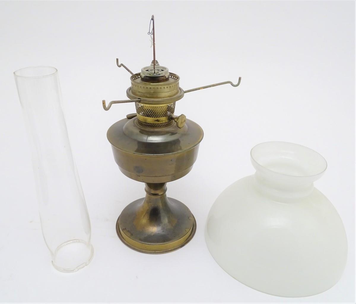 A 20thC oil lamp with a milk glass shade. Approx. 24 1/4" overall. Please Note - we do not make - Image 7 of 9