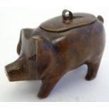 Treen: A 19thC carved wooden snuff box formed as a pig. Approx. 2" high. Please Note - we do not