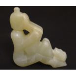 An Oriental erotic soapstone carving depicting two figures. Approx. 3 1/2" Please Note - we do not