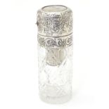 A cut glass scent bottle with silver mounts, marked sterling silver. Approx. 3 3/4" high Please Note