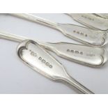 A set of nine Victorian Fiddle and Thread pattern teaspoons with engraved armorial to handle,