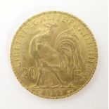 A French Republic 20 franc gold coin, 1909, approx. 6.45g Please Note - we do not make reference