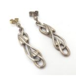A pair of silver drop earrings with Art Nouveau style decoration. Hallmarked Edinburgh 1994 maker