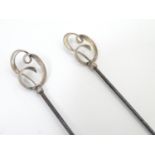 Charles Horner: A pair of hat pins surmounted by silver Art Nouveau scrolling decoration. marked