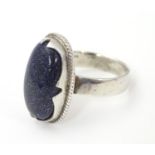 An Egyptian silver ring set with large blue aventurine stone cabochon. Ring size approx x Please