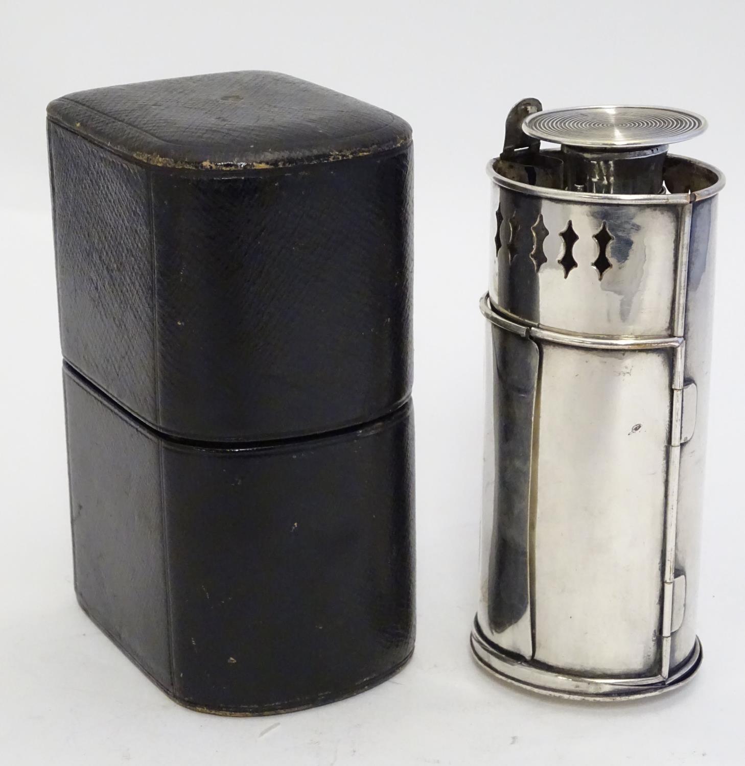 A 19thC silver plate travelling candle lantern with pierced decoration and double doors. Contained - Image 3 of 23