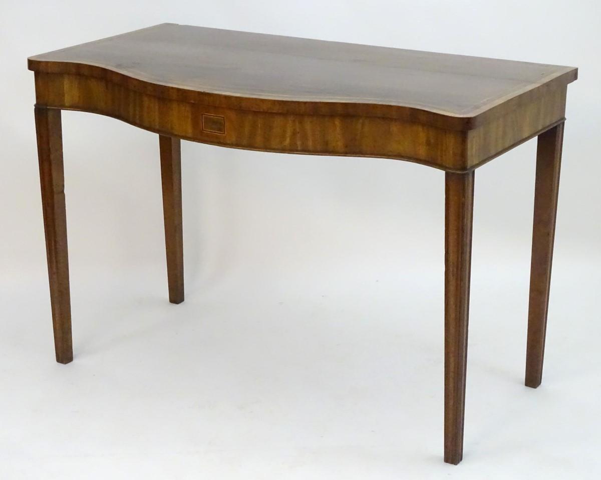 An early 19thC mahogany serving table with a serpentine shaped front, crossbanded top and having - Image 15 of 17