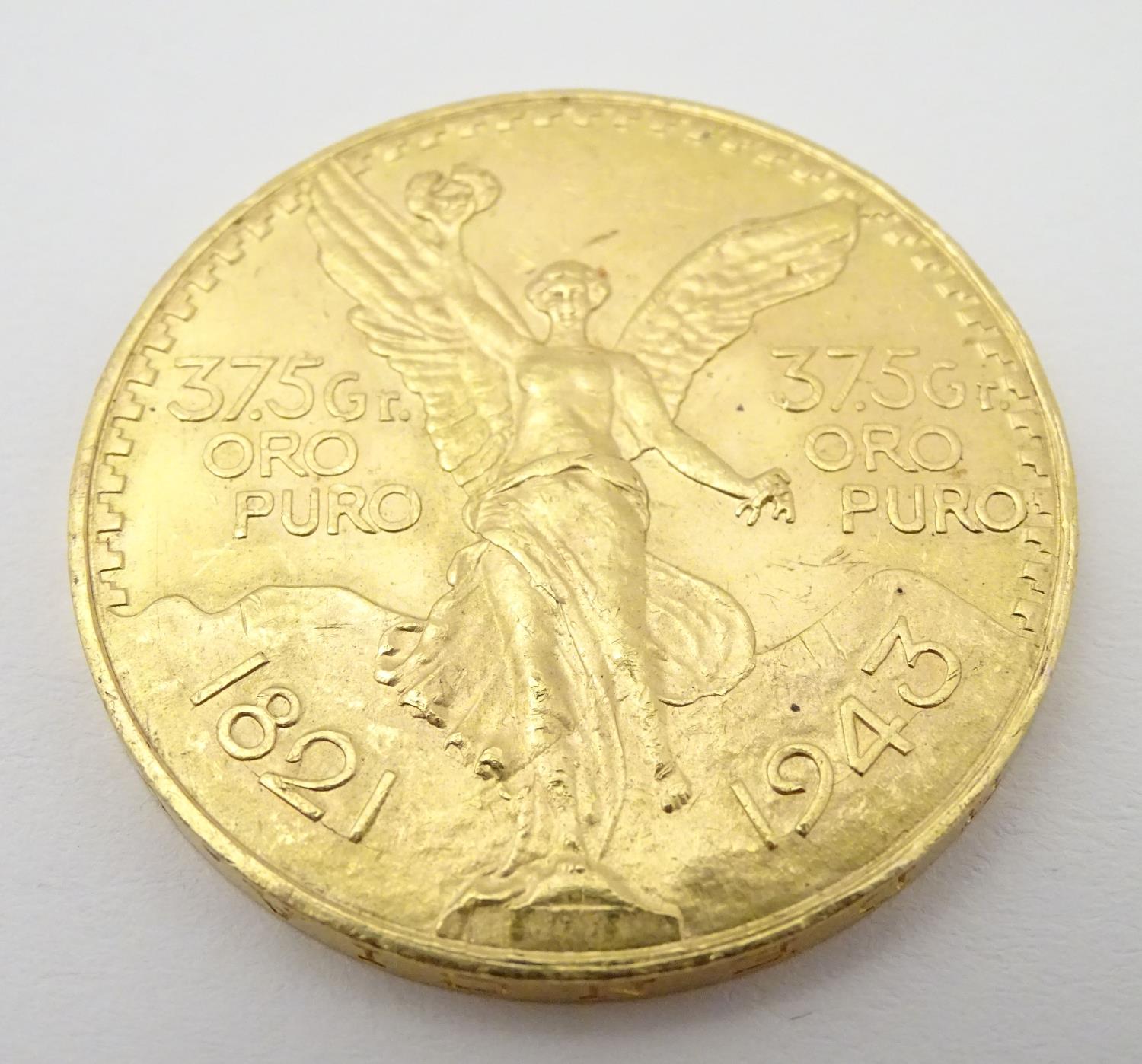 A 1943 gold 50 pesos coin commemorating Mexico's 100th anniversary of independence from Spain. The - Image 10 of 10