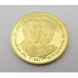 A 1981 gold Isle of Man crown commemorating the wedding of Charles and Diana. Approx. weight 7.81g