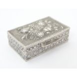 A Continental .800 silver pill box with cast decoration, maker Coppini & C. Approx. 1 1/2" wide