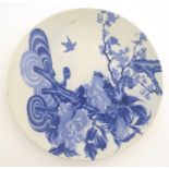 A Chinese blue and white charger with stylised tree decoration, with cherry blossom and blooming