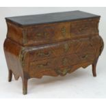 A late 20thC kingwood bombe commode with an ebonised top above three long drawers with ormolu