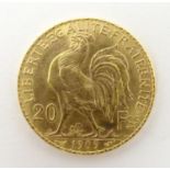 A French Republic 20 franc gold coin, 1909, approx. 6.45g Please Note - we do not make reference