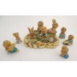 A quantity of pendelfin rabbit figures and display stand. Tallest figure approx. 4" high. (10)