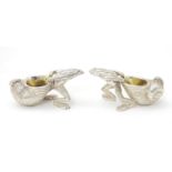 A pair of 21stC novelty silver plate salts formed as frogs. 4'' long Please Note - we do not make