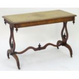 A late 19thC walnut centre table with a rectangular thumb moulded top above lyre shaped supports and
