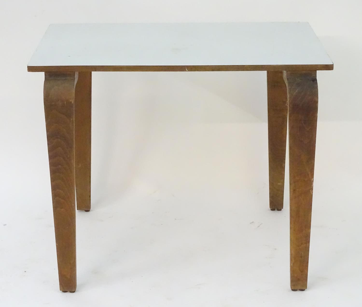 A mid 20thC table with a rectangular top above shaped tapered oak legs. 36" long x 24" wide x 29" - Image 11 of 13